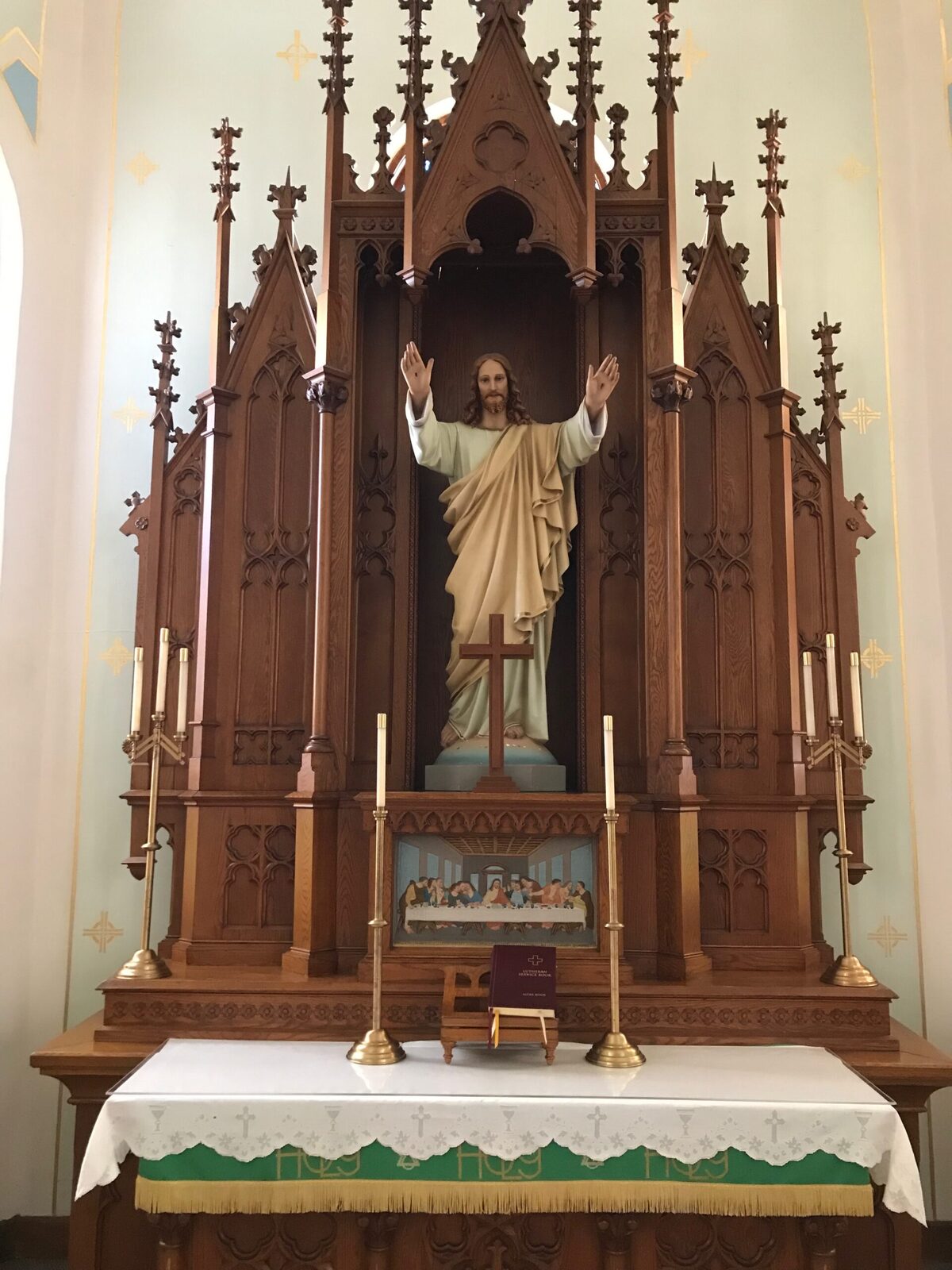 Risen Christ above the altar at St. John — Christ extending mercy to His people